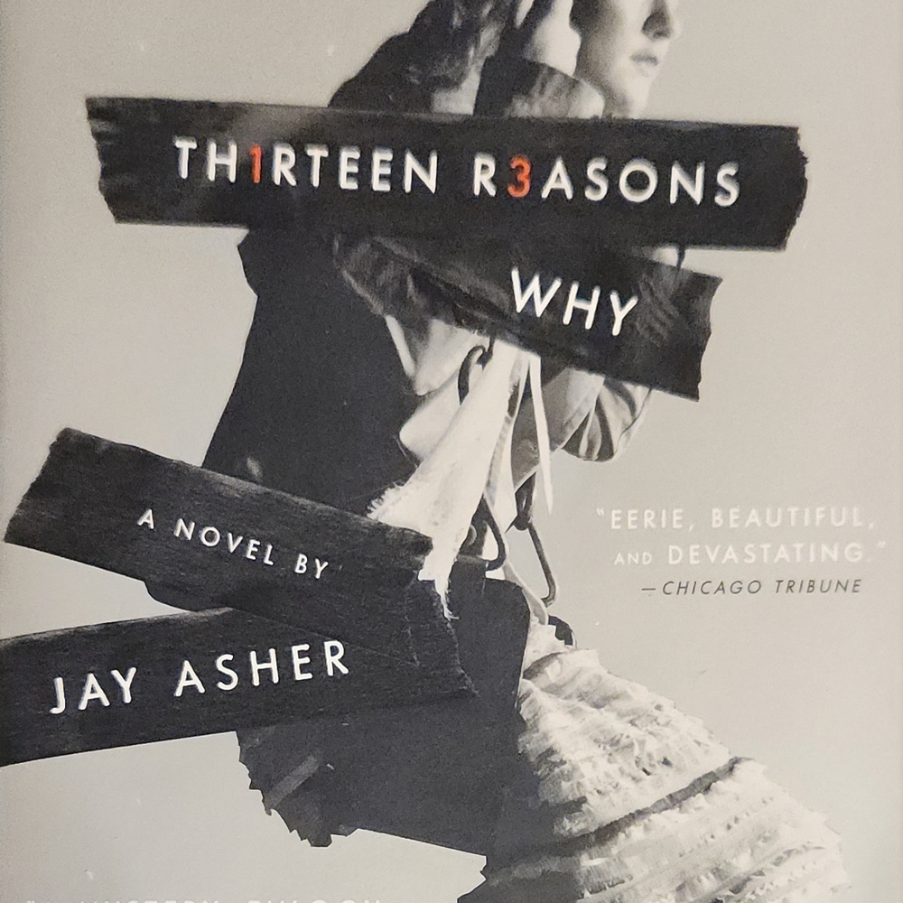 Thirteen Reasons Why by Jay Asher - Black, White & Orange Cover